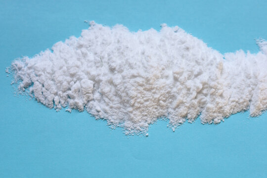 White creatine powder used as a pre-workout performance booster.