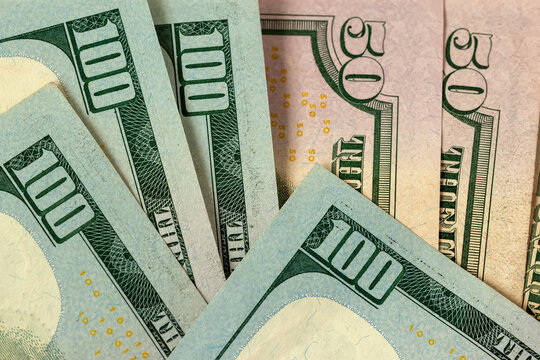 US Dollar Banknotes as Financial Background. Close-up of United States dollar banknotes, one hundred and fifty dollar denominations. Cash backdrop for finance, savings, banking, economy themes