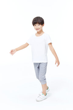 Happy Boy Posing with Arm Extended