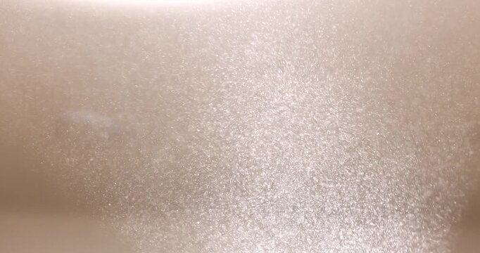 Soft light creates an enchanting sparkle on a smooth surface in a calm setting. The gentle reflections evoke a serene atmosphere, captivating the senses.