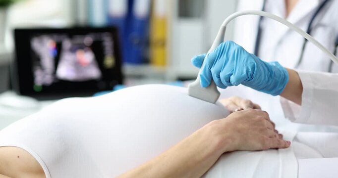 A healthcare professional gently conducts a prenatal ultrasound, showcasing the special bond between parent and child. The clinic radiates warmth, emphasizing care and joy in this milestone.