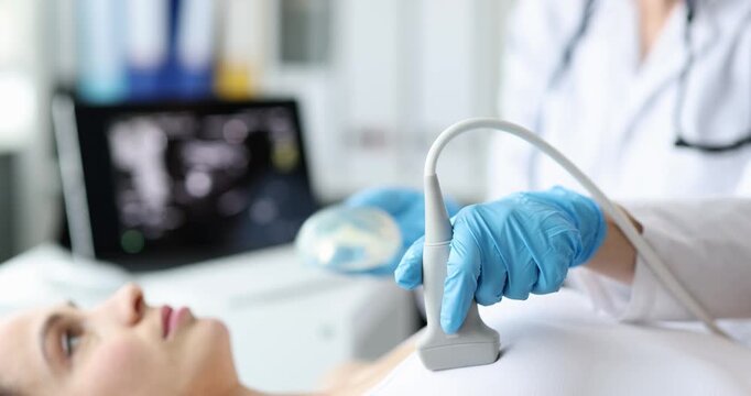 A skilled technician uses an ultrasound device on a patient in a bright, well-equipped clinic. The atmosphere is calm and professional, showcasing advanced medical technology.