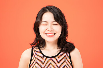 Fototapeta premium Asian Woman Smiling Eyes Closed