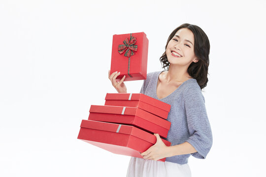 Happy Woman Holding Red Gift Boxes