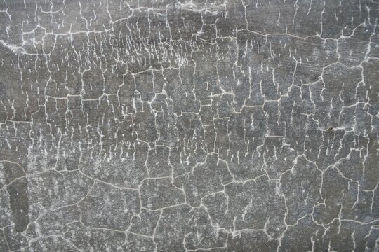 ​Close up background texture of cracked polished concrete wall surface