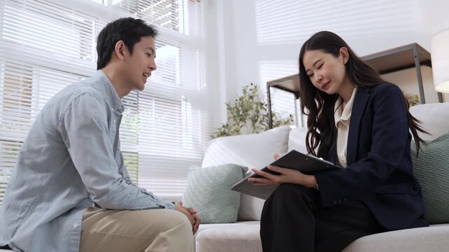 Financial Advisor and Client Discuss Wealth Planning, Finance Business Consultation, Laptop Review, Professional Home Discussion, Collaborative Decisions, Future Financial Security and Thoughtful