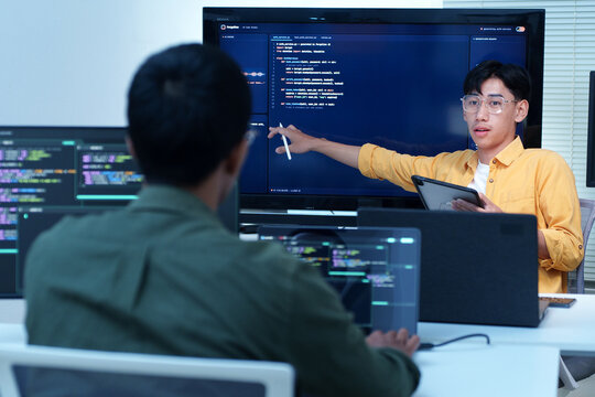 Programmer Presenting Code to a Developer