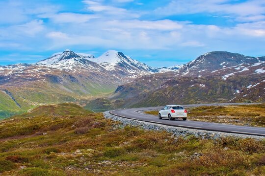 Car driving through Norwegian mountains and landscape, Panorama Road Tindevegen, Norway