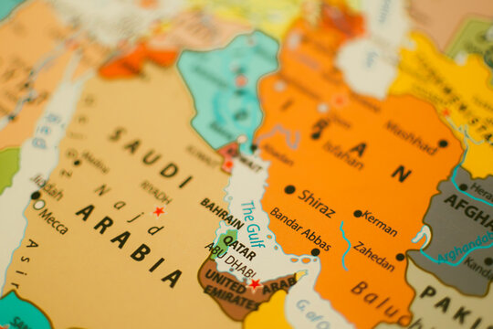 Close-up of a political map focusing on Qatar and the Persian Gulf, representing energy wealth, LNG trade, regional diplomacy, and Middle Eastern geopolitics.