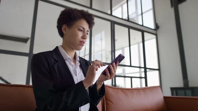 Worried Professional Reacting to Smartphone Alert