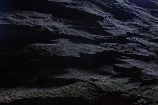Dark weathered stone ledge rock surface texture background