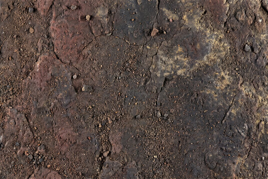 Venusian volcanic rock texture with dark rough crust