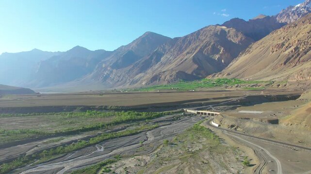 Aerial view of the deep Zanskar Gorge with its winding river and steep rocky cliffs in Zanskar, Ladakh, India.