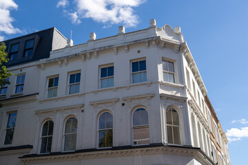 White Historic Corner Building with Windows and Cornice © MarshallChan