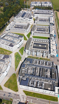 Aerial view of the DATA4 Milan Campus featuring large data center buildings with rooftop cooling units and solar panels surrounded by green spaces in Zona Industriale, Lombardia, Italy.