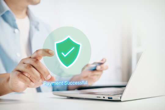 Secure online payment success concept, glowing green shield and check mark, customer using Digital Interface on laptop, digital transaction approval, financial security, fintech and cashless commerce