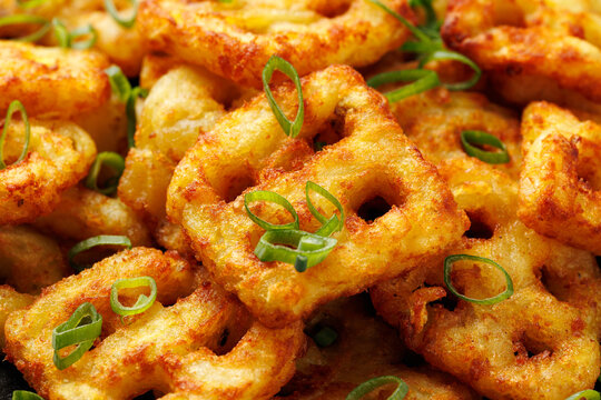 Hash Brown Waffles with Spring Onion on black plate