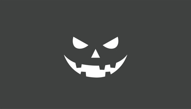 Scary glowing jack-o-lantern face with evil eyes and a toothy grin, isolated on a dark gray background.