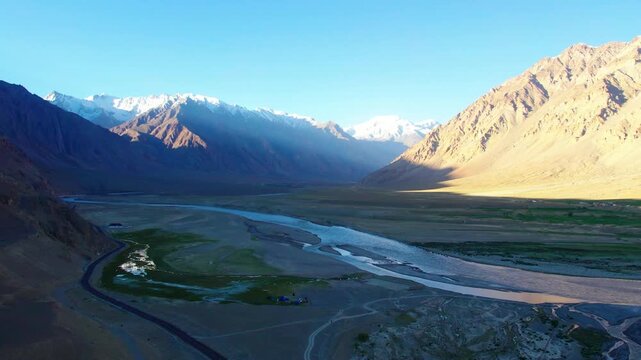 Aerial view of the deep Zanskar Gorge with its winding river and steep rocky cliffs in Zanskar, Ladakh, India.