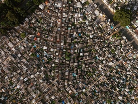 Aerial view of the Maximo Gomez National Cemetery featuring dense rows of tombs, narrow pathways, and scattered trees in Santo Domingo, Distrito Nacional, Dominican Republic.