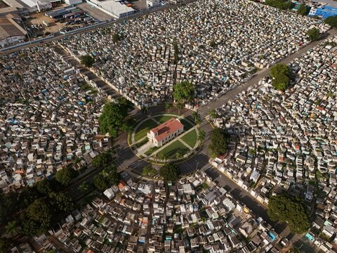 Aerial view of the Maximo Gomez National Cemetery featuring a central chapel surrounded by dense rows of graves and tombs in Santo Domingo, Distrito Nacional, Dominican Republic.