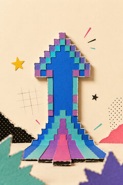 Level up progress and growth in retro gaming shown as a handmade pixel arrow rising upward made from painted cardboard and paper