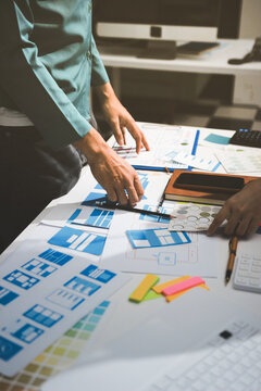 UI designer and UX developer brainstorm idea to design the application appearance in the early stage. Creative digital development agency. UX UI concept