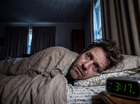 Man Suffering From Insomnia and Sleepless Night