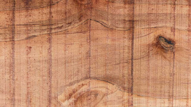 Rustic Amber Brown Wood Texture Background with Wavy Parabolic Grain and Knot
