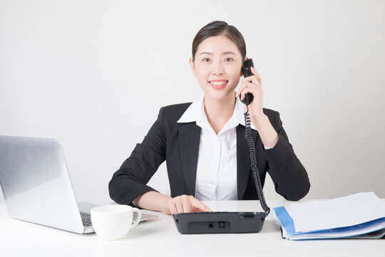 Businesswoman on phone at desk
