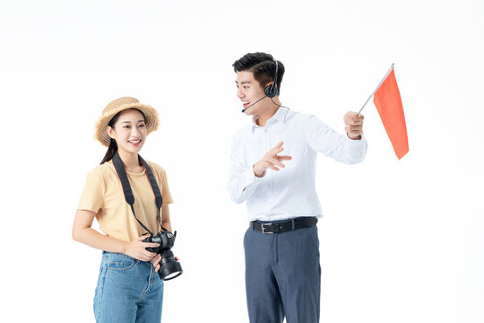 Tour guide introducing sightseeing route to female tourist with camera