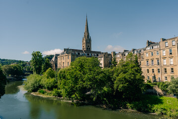 Obraz premium River Avon and St John the Evangelist Church in Bath, Somerset, England, UK - 4 September 2026.