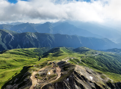 Wonderful summer view of alpine meadows at the foot of Tetnuldi peak. Stunning morning landscape of Upper Svaneti, Georgia, Europe. Beautiful outdoors scene of Caucasus mountains