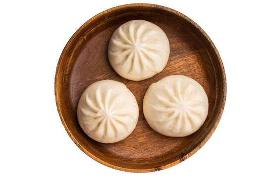 Dumpling Momos with pork meat in wooden plate isolated on white background. top view