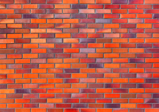 Colorful orange and red brick wall pattern texture background, modern gradient clinker tiles facade with copy space concept