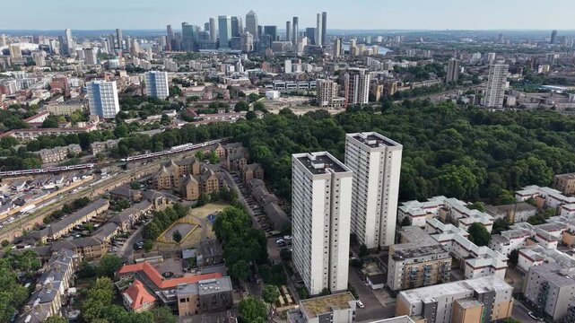 Aerial Drone Shot of Mile End Towers and Canary Wharf Skyline, London