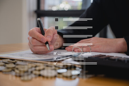 Data analysis concept, An analyst uses paper report and dashboard for data business analysis and Data Management System with KPI and metrics connected to the database research and study.