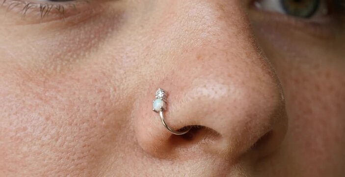 Macro Close Up of Woman Nose with Opal and Diamond Silver Nostril Hoop Ring