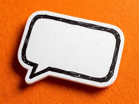Blank white empty speech bubble on orange textured background, ready for custom text message or design element for communication or graphic projects.
