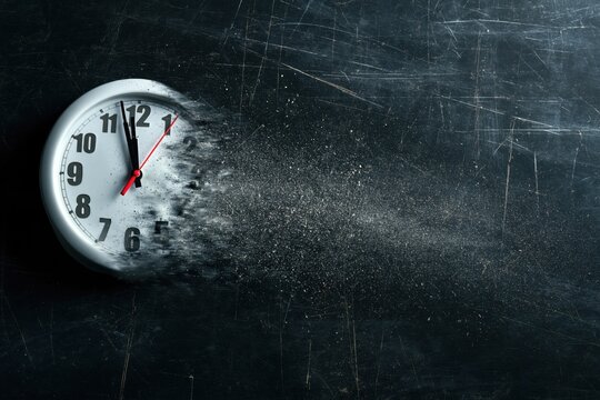 Time is running out concept shows clock that is dissolving away into little particles