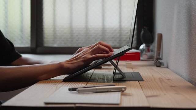 Hands Typing on Tablet Keyboard Close Up Slow Motion 4K