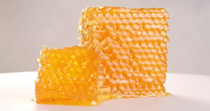 Piece of honeycomb close-up video on rotating table.