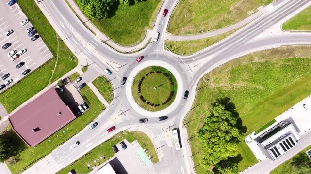 Top down view of roundabout, urban streets, surrounding buildings