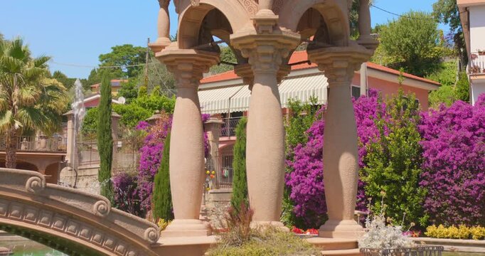 Ornate Stone Bridge And Columns In The Garden Of Villa Grock In Imperia, Italy. - tilt up shot