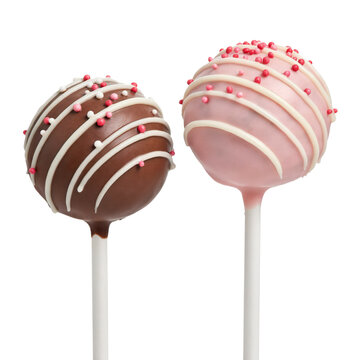 Two cake pops, one milk chocolate and one pink glazed, decorated with white drizzle and small sugar sprinkles isolated on a transparent background