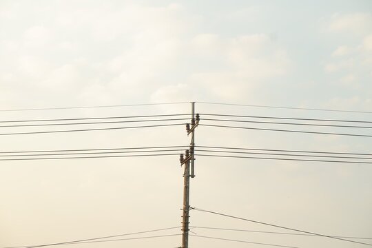 Electrical infrastructure and power line cables in a calm agricultural area