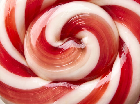 Macro texture of red and white twisted spiral peppermint candy