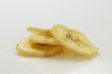 Dried Banana Chips assorted on white background © Thomas Montini
