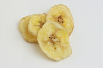 Dried Banana Chips assorted on white background © Thomas Montini