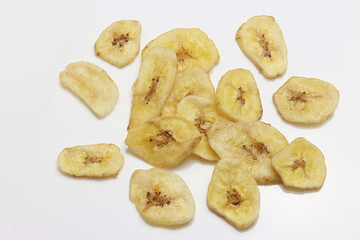 Dried Banana Chips assorted on white background © Thomas Montini